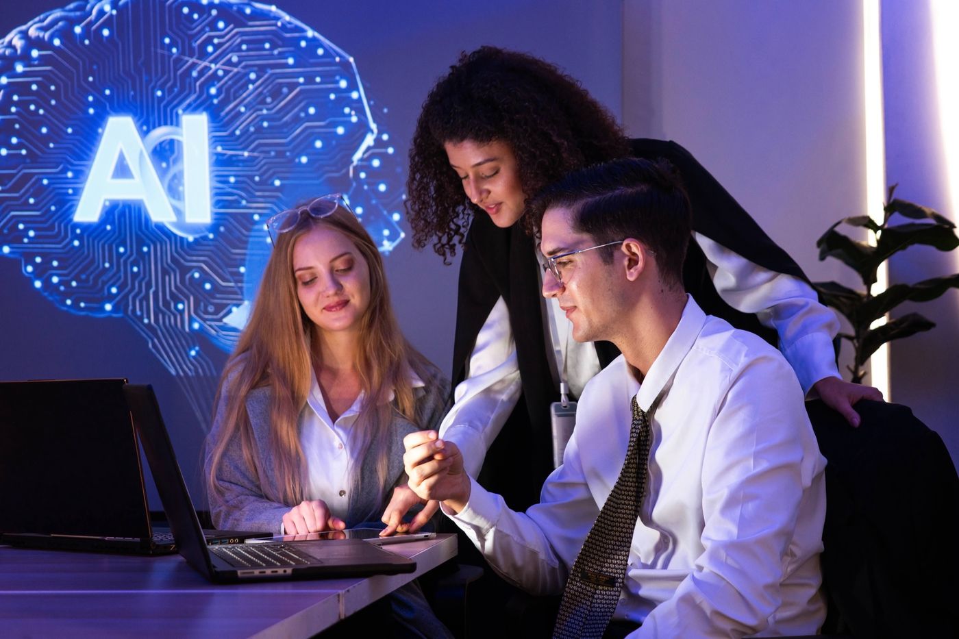 Three colleagues review an AI solution together on a tablet