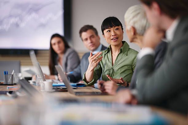 A consultant explains an approach to a client team around a conference table